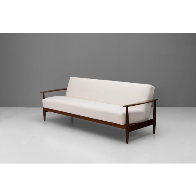 Mid-Century sofa bed with solid teak frame newly polished and re-covered in cream boucle fabric. U.K circa 1960. Depth...