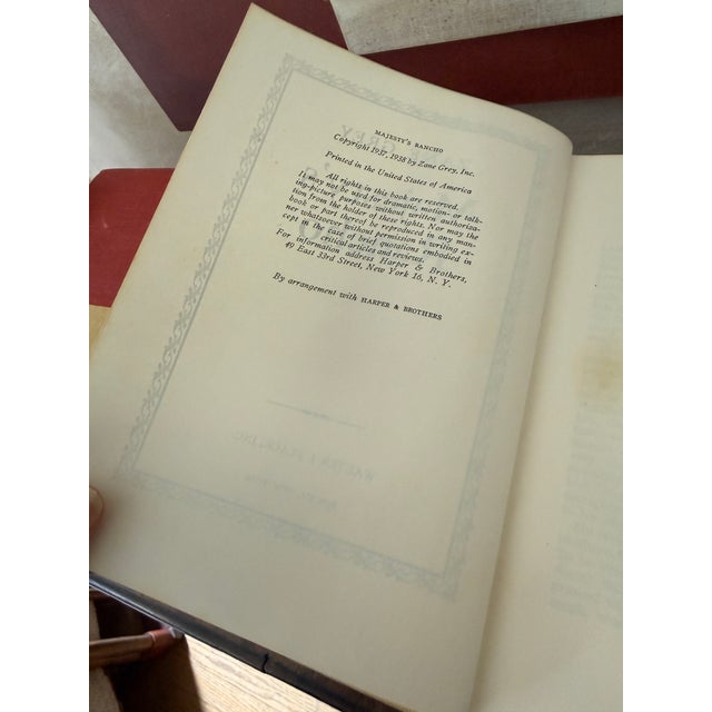 Mid-Century Set of 27 (Twenty Seven) Zane Grey Books Vintage Western Collection Tan Cloth Binding Red Blue Spine For Sale - Image 11 of 12