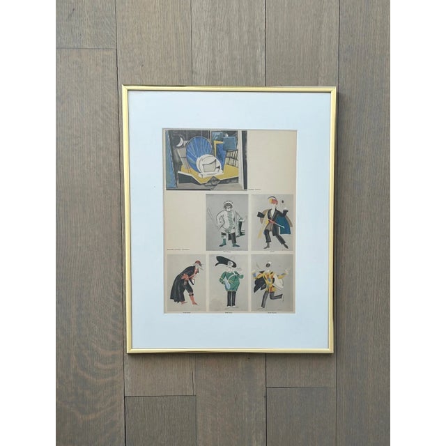 Set of four framed prints featuring costume designs by Lee Simonson, Max Reinhardt, Ignaty Nivinsky, and Strnad. Prints...