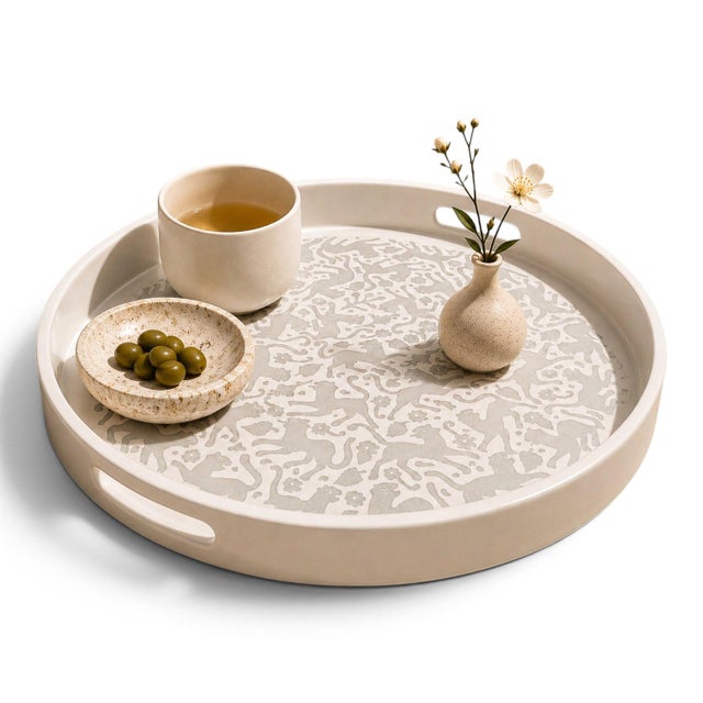 Executed in the historic maque lacquer tradition of Olinalá, Guerrero, Mexico, this circular tray reflects a lineage of...