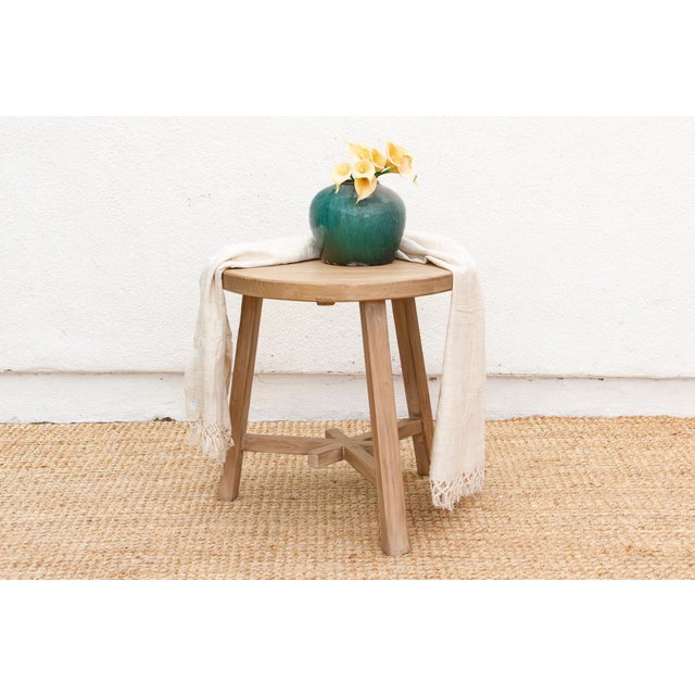 Discover the pure, unadorned beauty of natural materials with this magnificent reclaimed wood round end table. Measuring a...