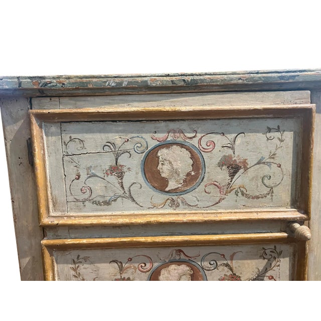 With rectangular faux marble top over a door with enclosed shelf, raised on cabriole legs. Original painted decoration.