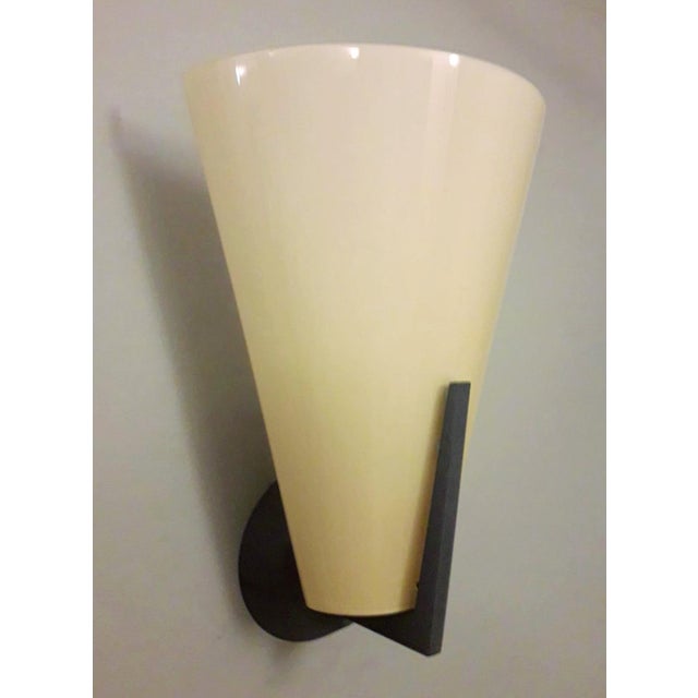 Vintage Italian wall lights with yellow Murano glass shades mounted on black metal frames / Made in Italy by I TRE, circa...