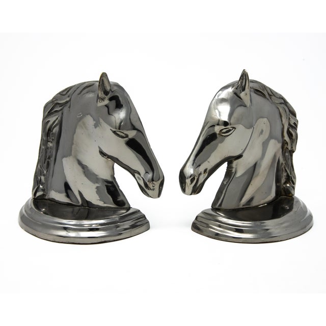 Offering this set of horse head bookends. When the two sides are together it makes a single horse head. They are metal...