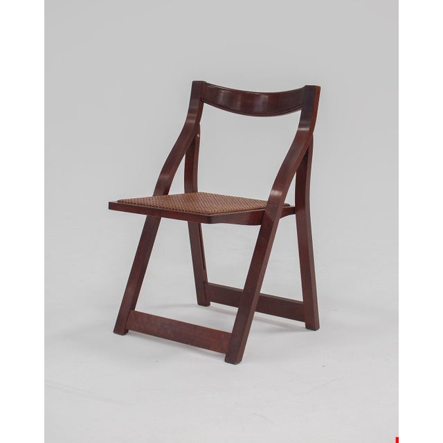 Folding lacquered wood slatted chairs in the style of the Trieste design by Aldo Jacober for Alberto Bazzani. The chairs...