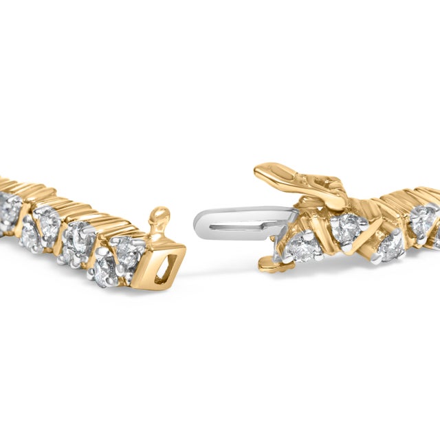 Imbued with a radiant harmony of luxury and geometric sophistication, this exquisite tennis bracelet features a stunning...