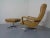 Mustard-coloured, swivel leather armchair with ottoman from the 1970s. Armchair dimensions: Height 97 cm. Width 78 cm....