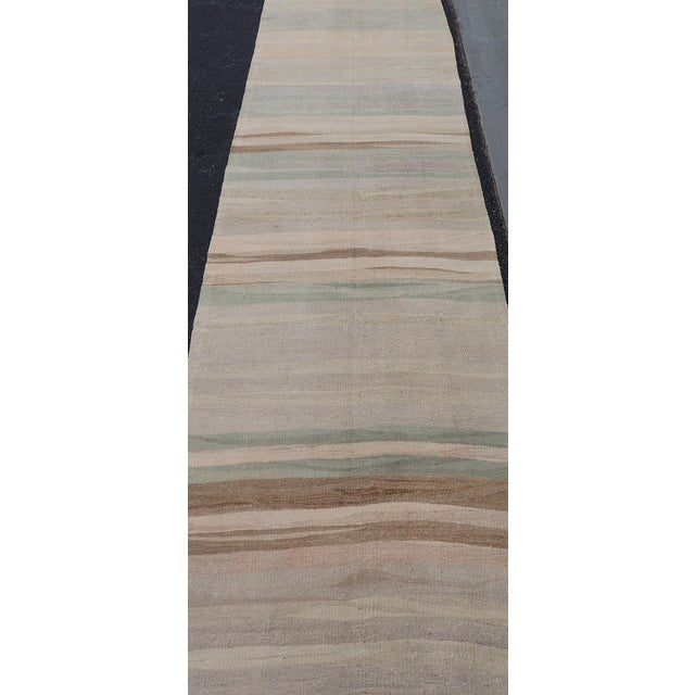 Measures: 3'2" x 22'7" Subtle Horizontal Stripe Design Turkish Vintage Kilim Runner in Soft Pastel Neutrals. Keivan Woven...