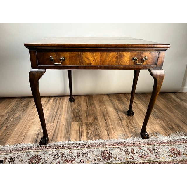 Inspired by the elegant furniture of 18th-century England, this handsome Georgian-style Chippendale game table was crafted...