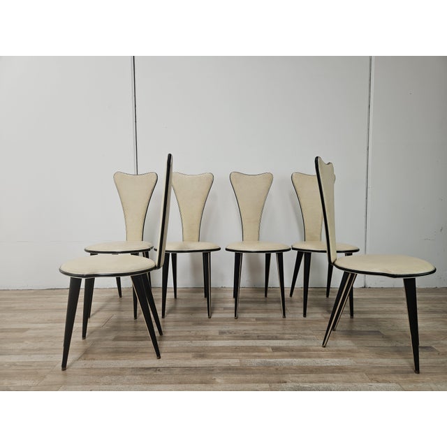 An elegant set of six dining chairs by Umberto Mascagni, made in Italy in the 1950s, featuring a refined retro design and...