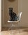 Large vintage ceramic panther sculpture finished in a deep, high-gloss black glaze. The seated form has a strong...