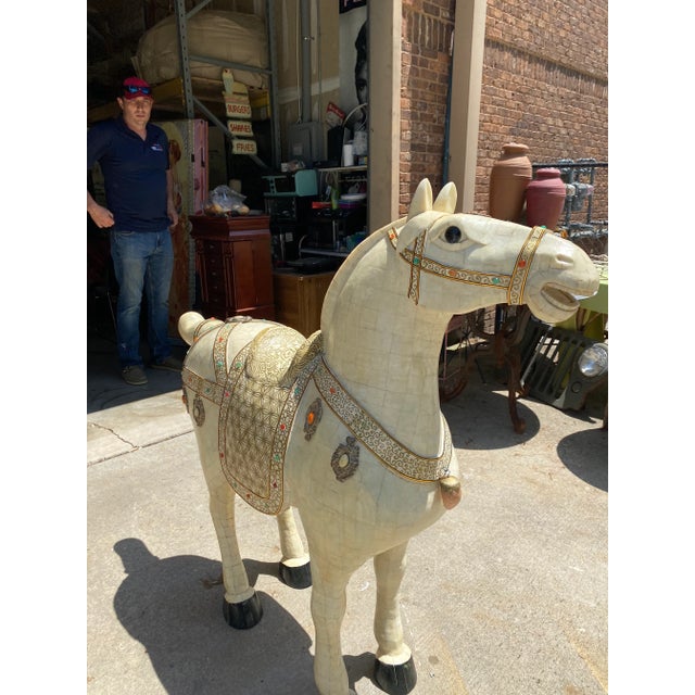This is a beautiful marble carved life size horse. It is designed with unique gems all over it. Perfect for the interior...