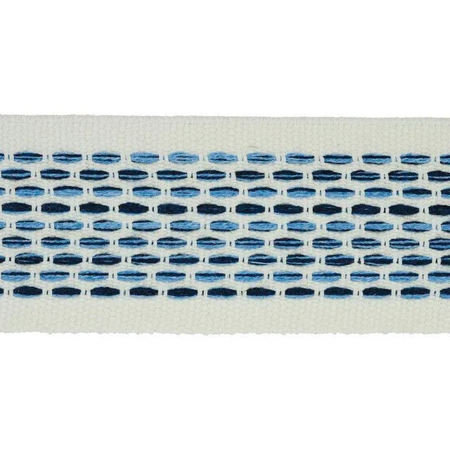 Stitches in variegated tones form a dappled stripe pattern on an understated high-performance tape with loads of tactile...