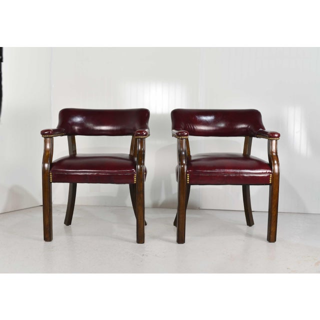Make yourself comfortable with these stunning vintage oxblood leather armchairs. The fine-quality leather chairs \ are...