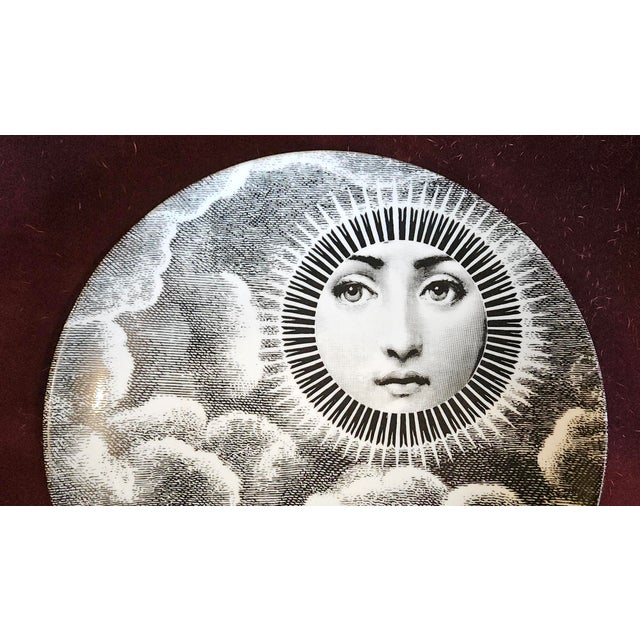 Celestial Symmetry: The Sun-Faced Muse of Piero Fornasetti This porcelain plate from Piero Fornasetti’s most famous...