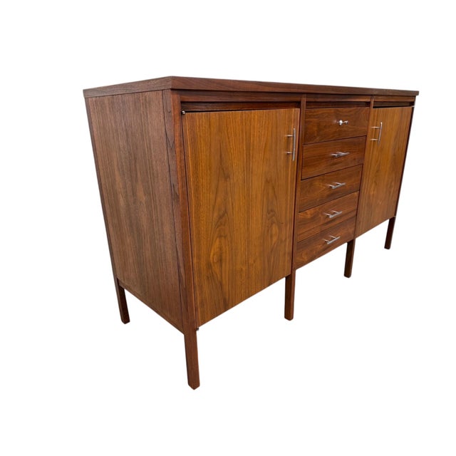 Elevate your space with this exceptional circa 1960s Mid-Century Modern sideboard designed by Paul McCobb for Lane...