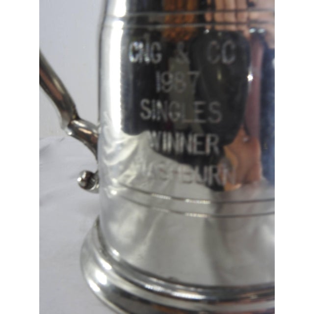 This Sheffield tankard is accented by a scrolling handle on the side. The tankard itself has curvy lines to add to its...
