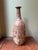 Beautiful handcrafted stoneware vessel with a rich brown glaze and striking crawling ("fat lava") glaze over the body....