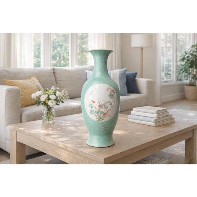 Elegant 10-inch porcelain vase featuring a vibrant turquoise ground with a raised, textured pattern that catches the light...