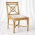 An elegant set of six French rattan dining chairs, crafted in the manner of McGuire and distinguished by their sculptural...