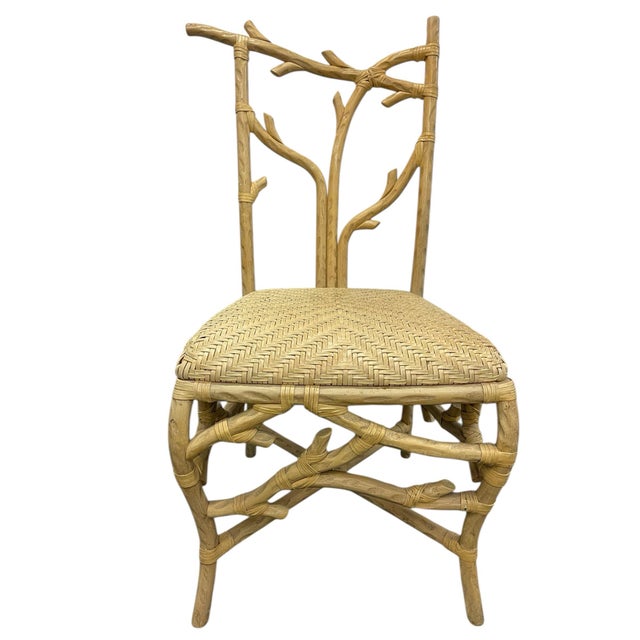 Sculptural architectural side chair crafted in a faux bois, branch-form design with hand-wrapped rattan construction. The...