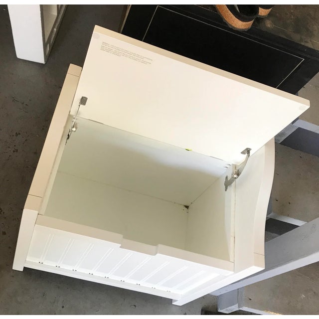 Panted white hamper seat with lid, or bench seat, that raises to show storage compartment. Highly polish chrome hardware...