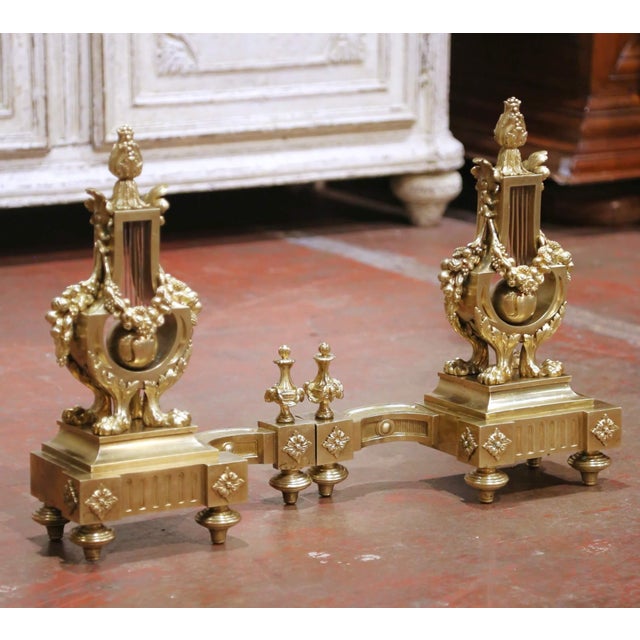 Bring timeless French elegance to a fireplace with this exceptional pair of antique Louis XVI bronze chenets. Crafted in...