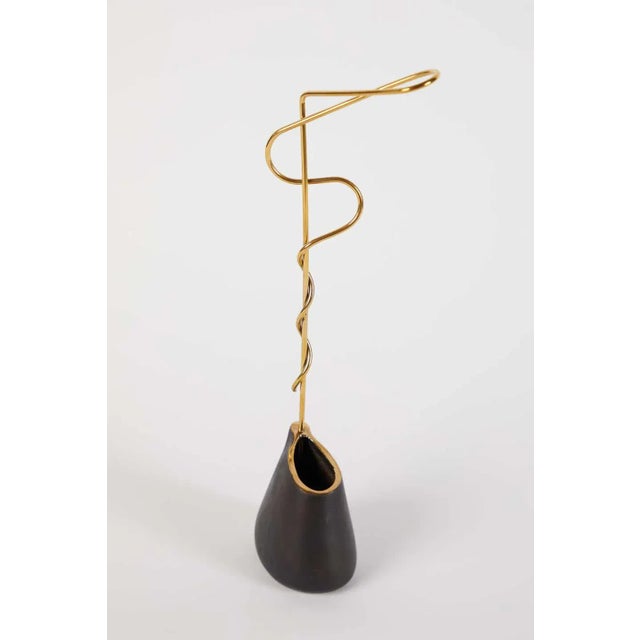 Carl Auböck model #7420 brass vase designed in the 1950s, this incredibly refined and sculptural Viennese vase is executed...