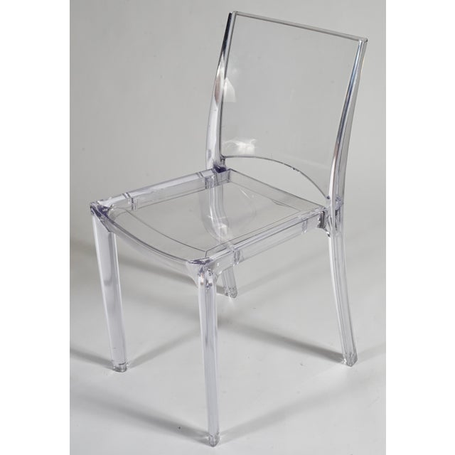 Set apart by its sinuous lines, this chair is made from high-quality clear polycarbonate, an extremely durable and...