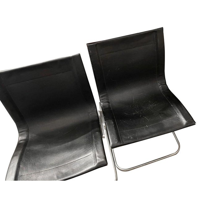 Four chairs with metal structure and leather upholstery, model 'Lia', designed by Claudio Salocchi. Original brand. Slight...