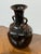 Design Plus Gallery presents an Antique Replica Ceramic Vase. The rounded body rises to a narrow neck and flared opening,...