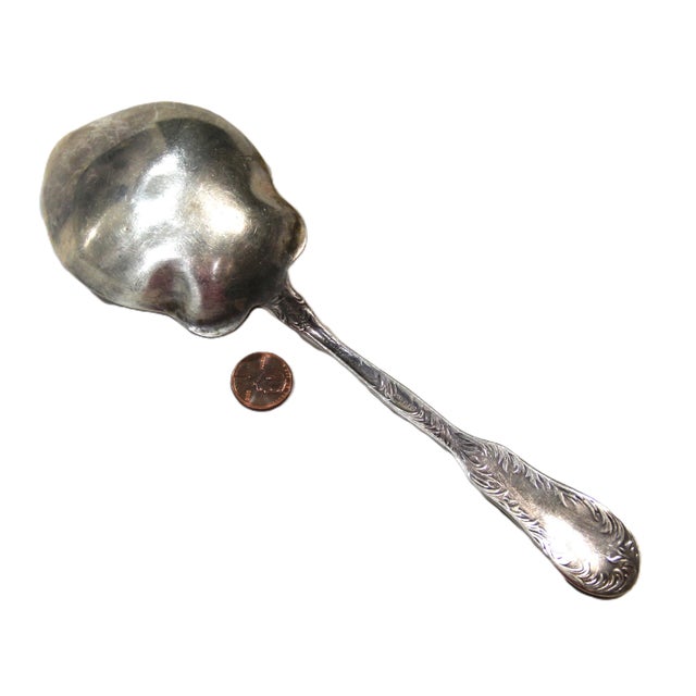Beautiful floral pattern sterling silver serving spoon by J.W. Mealy, Hallmarked for sterling and with makers name....