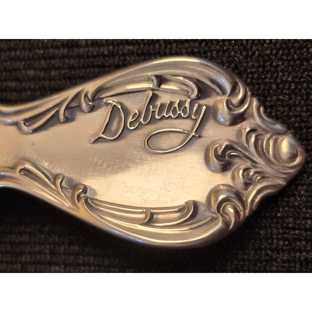Classic 12-place set from Towle 1959 Sterling Silver flatware, Debussy pattern. This 88-piece set contains: 12 dinner-size...