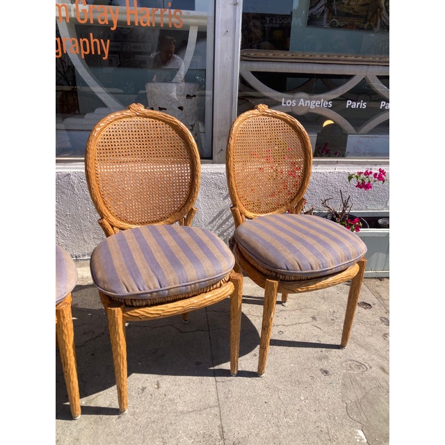 Set of 4 Faux Bois French Louis Style Side Dining Chairs with Cain Backs and Rush Seats. Loose cushions with ties in...