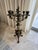 Elevate your space with this stunning turn-of-the-century bronze candelabra, a timeless piece that effortlessly blends...