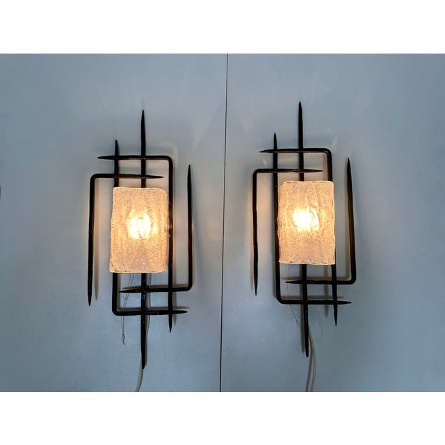 This set of two large sculptural wall lights in brutalist design was handcrafted in West-Germany during the 1960s by...