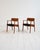 Pair of solid teak armchairs with curved backrests and black wool-upholstered seats. Designed by Henning Kjærnulf for Sorø...