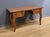 This solid cherry desk table dating from the second half of the 19th century, has a rectangular top made of wide, well-...