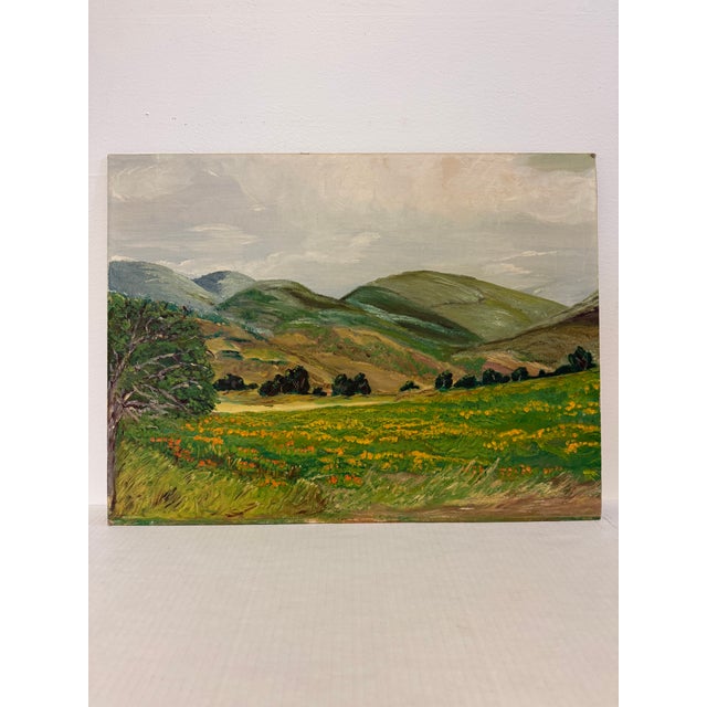The artwork presents a serene landscape characterized by rolling hills and a vibrant field filled with flowers, showcasing...