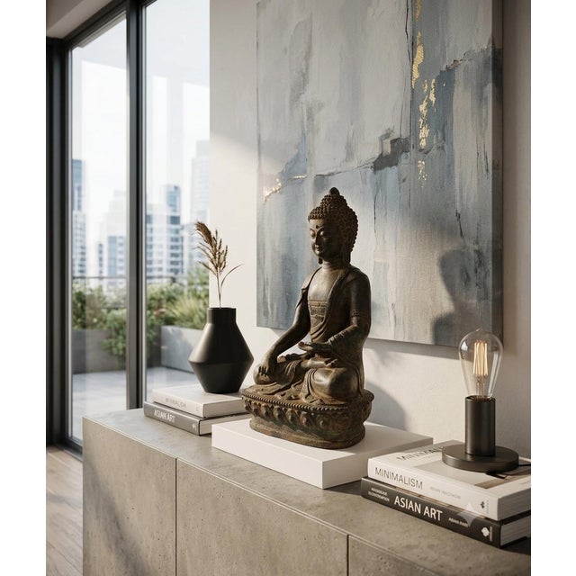An unique bronze figure of Young Buddha Shakyamuni, with a wonderful smile and youthful visage. Seated in the full lotus...