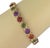 The Multi-Color Bezel Set Round Gems 14k Yellow Gold Link Bracelet is a stunning piece of vintage and antique jewelry....