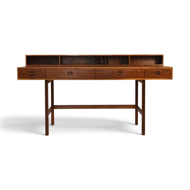 This 1970s Peter Lovig flip top desk is a clean piece of Danish cabinetmaking, built in teak with almost nothing on it...
