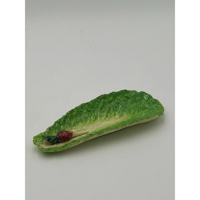 A pair of late nineteenth-century Italian majolica dishes modelled as crisp lettuce leaves, executed in glazed earthenware...