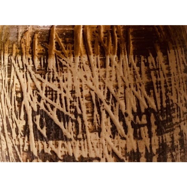 This one is all about texture. The lower body appears unglazed and deeply combed in an all-over pattern that recalls...