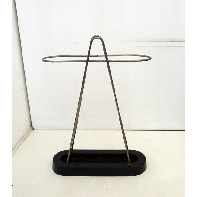 Modernist umbrella stand, Bauhaus design style: oblong base with four compartments in heavy black cast aluminum and a...