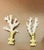 Organic modern sea ocean branch fragments placed on brass bases as lamp finials.