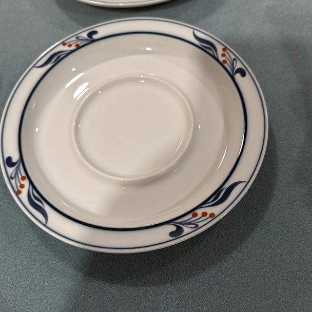This item is a Dansk Bistro saucer, a discontinued pattern produced between 1981 and 1997. Design: Features a white...
