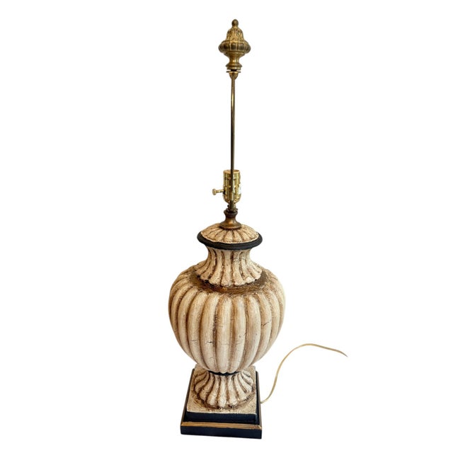 John-Richard Neoclassical Style Urn Lamp This lamp features a central urn type shape with an antiqued finish. There is a...