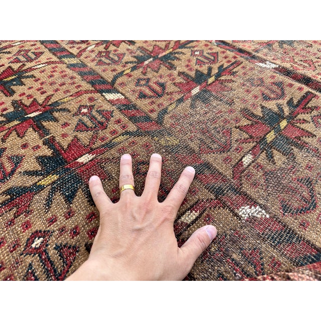 This hand-knotted Serab rug features the classic camel-ground design of its namesake village — vertical rows of crenelated...