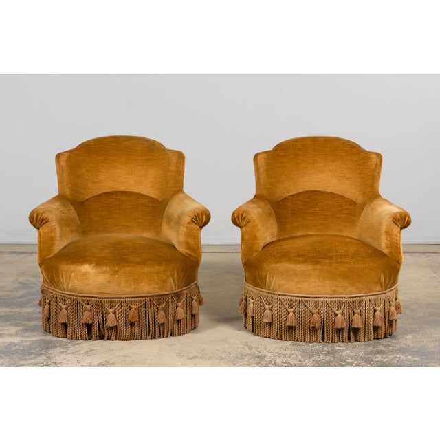 A refined pair of 19th-century French Napoleon III crapaud armchairs, sourced in Paris. Each chair is handcrafted with a...